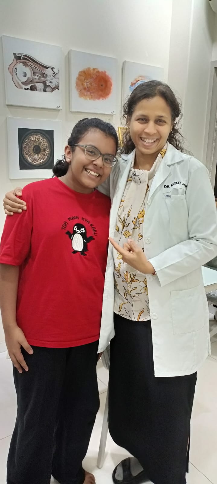 Doctor standing with a smiling pediatric patient