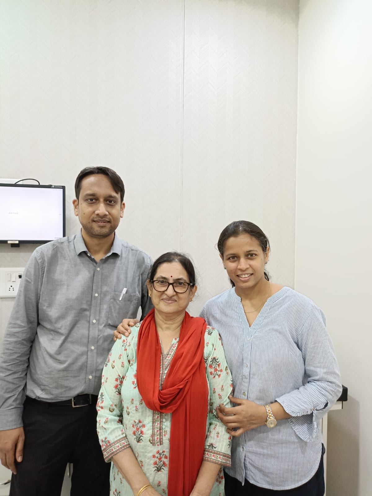 Doctors standing with a patient after eye care